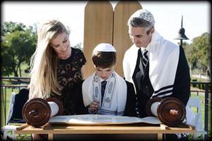 Ryan and his parents with the Torah  Maria McCarthy Photography